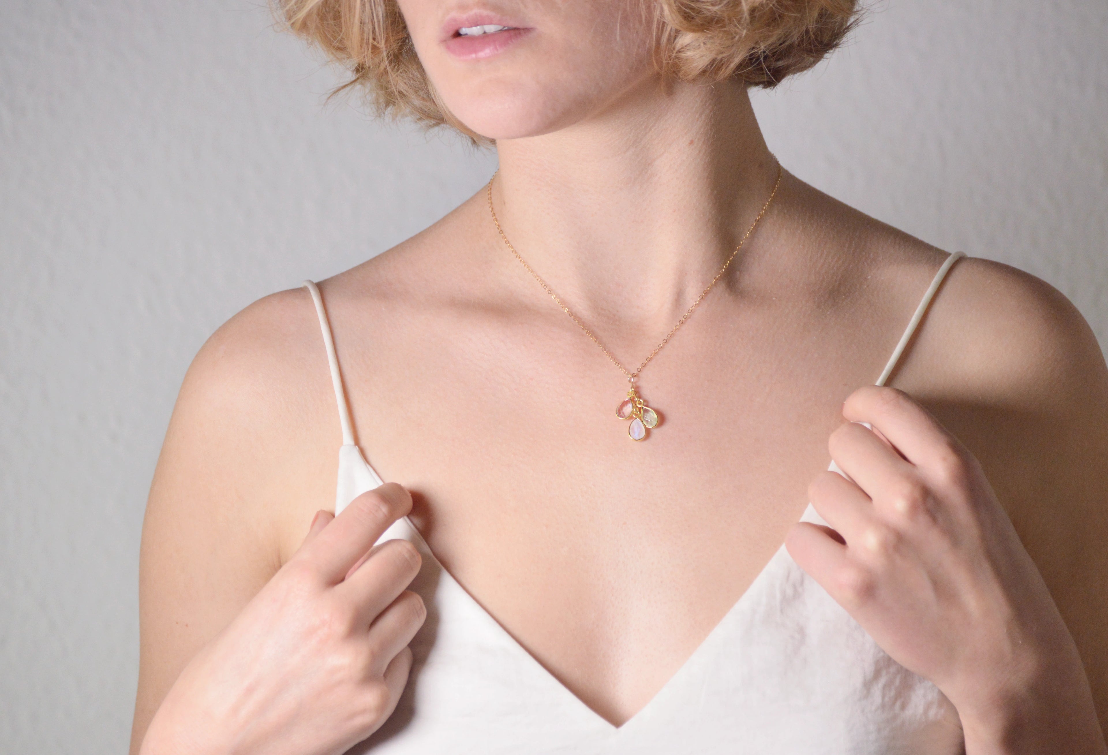 Peronsalised Necklace woman in gold hanging three stones, Pink stone , greens stone and white blue stone.