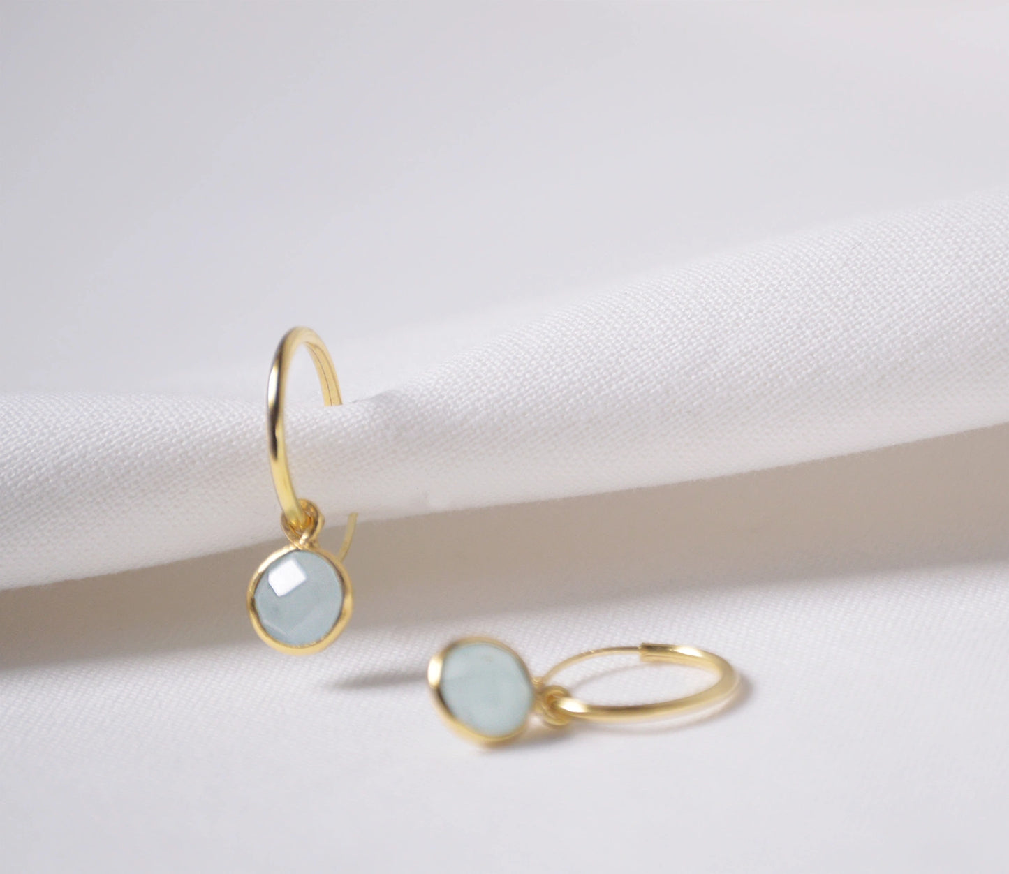 Aquamarine huggie hoop gold earrings